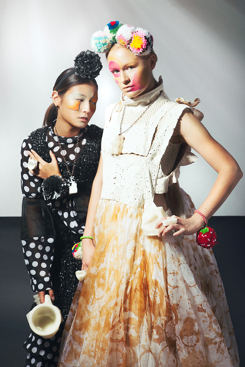 Two coordinated runway looks with hand-knit volume and accessory detailing