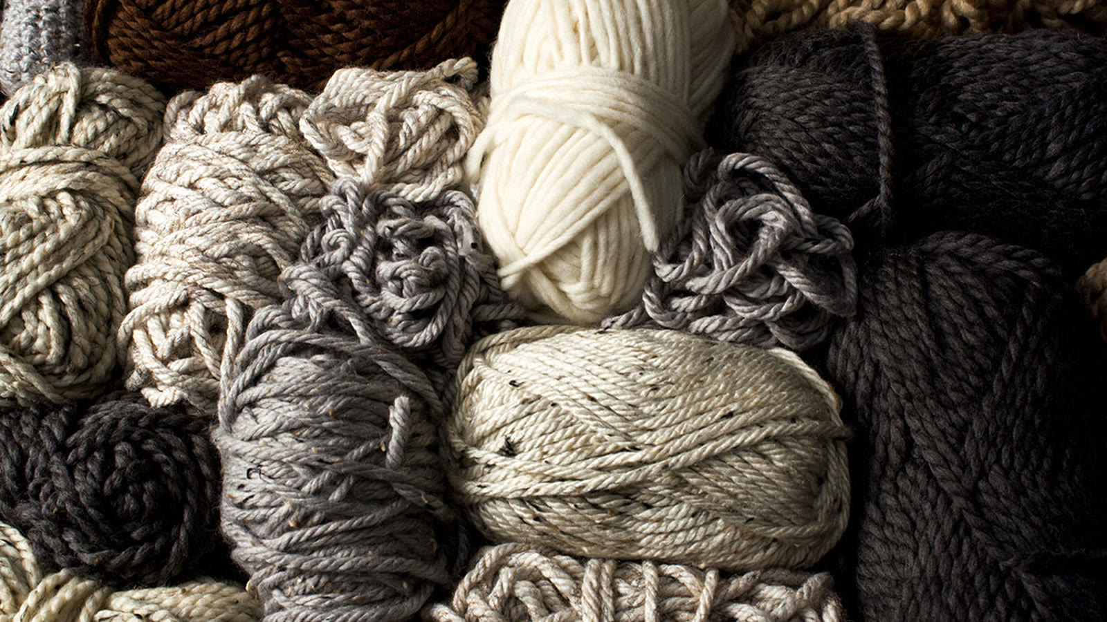 Assorted neutral yarns arranged for knitwear material development