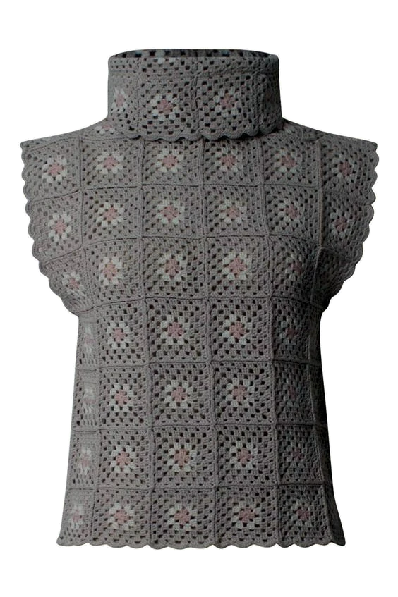 Transparent cutout of a grey crochet shell with modular square construction
