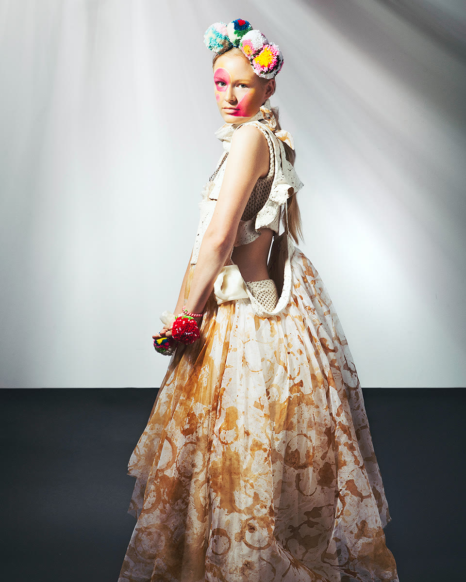 Archive image of cream-toned runway dress with textured knit details